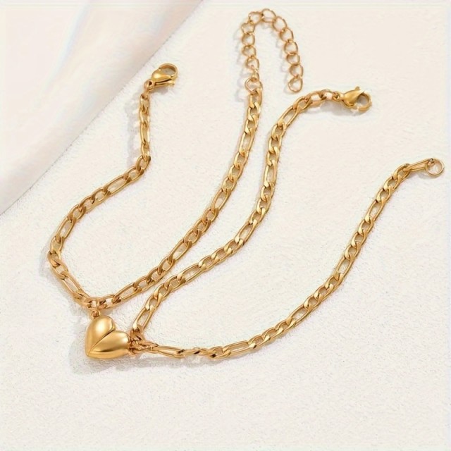 Komplet 2 zlatih zapestnic za pare z magnetnim srcem