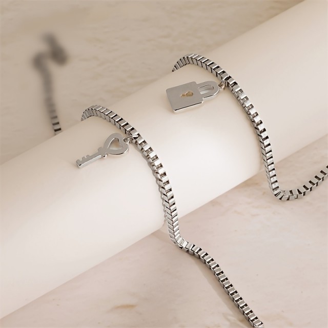 Komplet 2 zapestnic za pare s ključavnico in ključkom