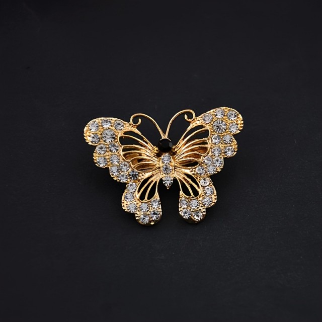 Elegantna črnozlata broška v obliki metulja
