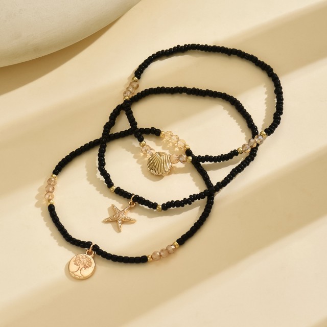 Komplet 3 zapestnic za nogo v črno - zlati kombinaciji