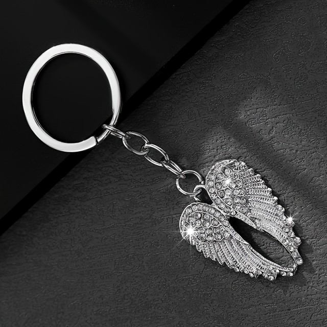Obesek za ključe z bleščečimi krili