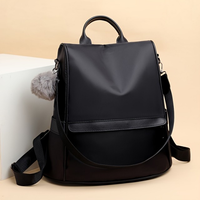 Ženski nahrbtnik z nastavljivimi jermeni in pomponom