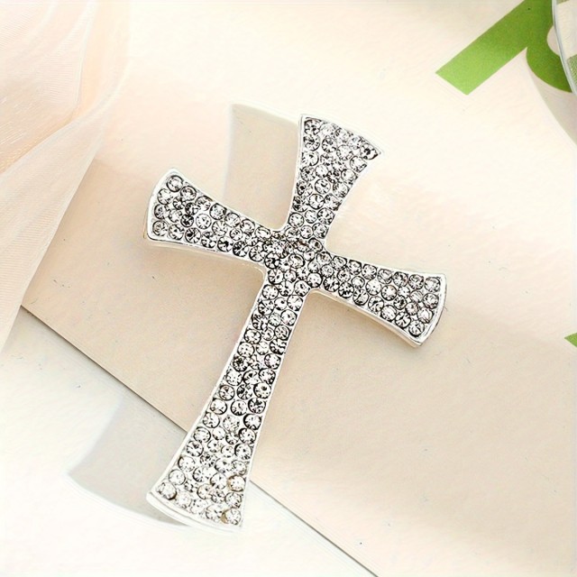 Elegantna broška v obliki križa srebrne barve 