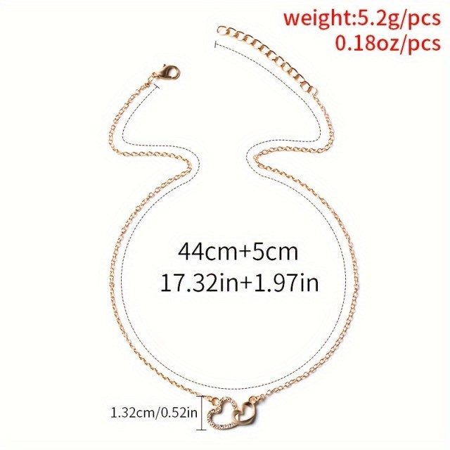 Elegantna ogrlica z dvojnim srcem v zlati barvi