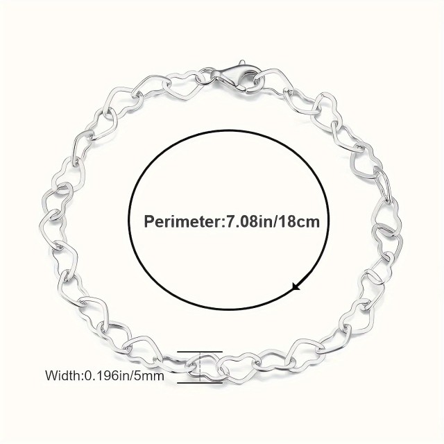 Elegantna zapestnica srebrne barve z izrezljanimi srci