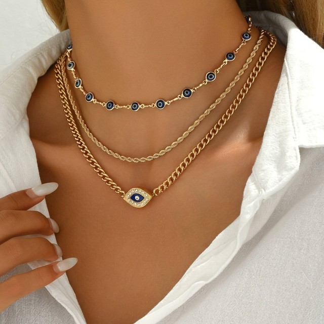 Tridelna ogrlica v zlati barvi z Evil eye 