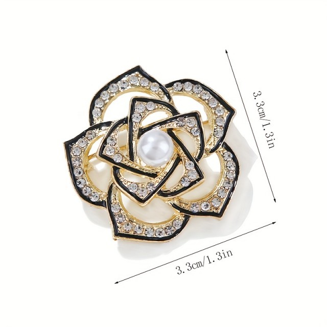 Elegantna broška s cvetom v črno-zlati barvi