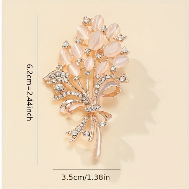 Elegantna cvetlična broška z okrasnimi kamni