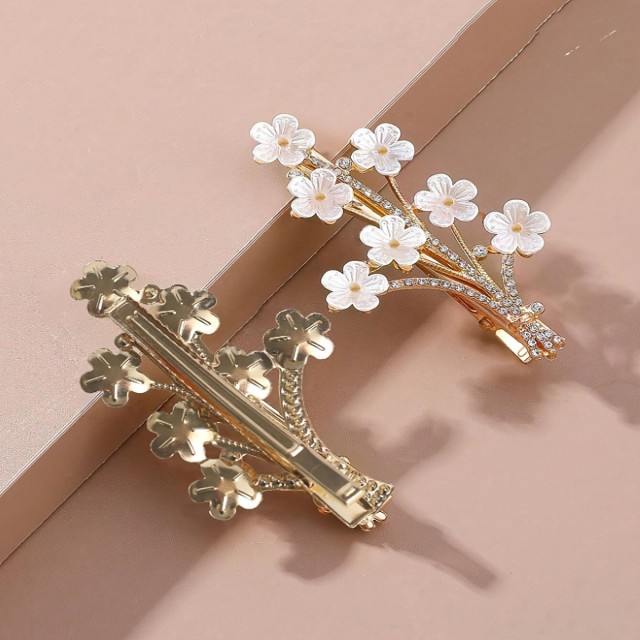 Elegantna cvetlična sponka za lase – zlati detajli