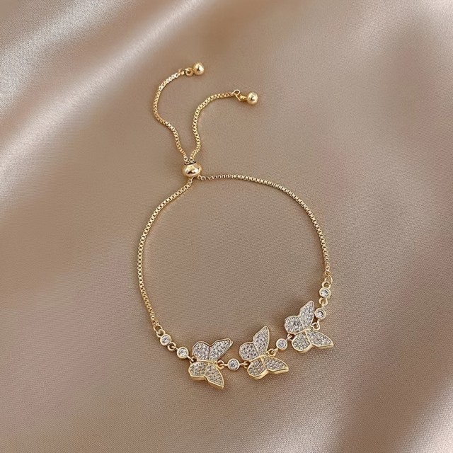 Prestižna zlata zapestnica z metulji in kamenčki