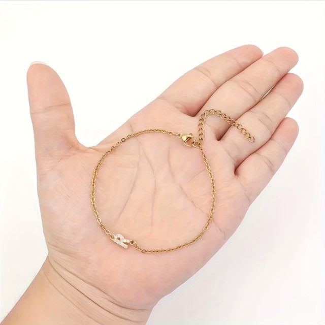 Nastavljiva zlata zapestnica z inicialko