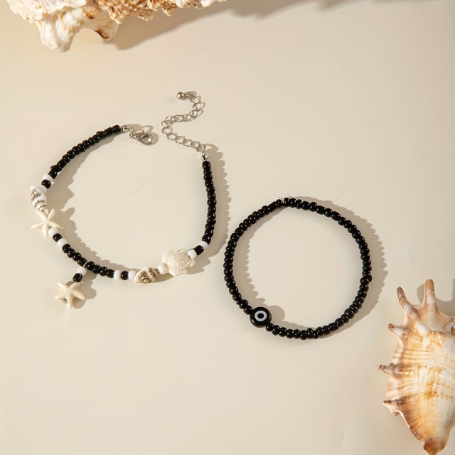 Komplet 2 zapestnic za nogo z morsko zvezdo, školjkami in modrim očesom