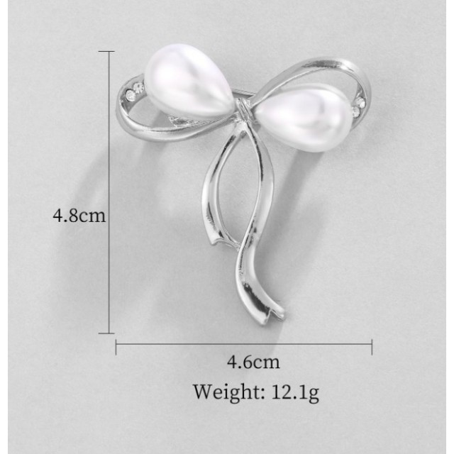 Elegantna broška zlate ali srebrne barve s pentljico