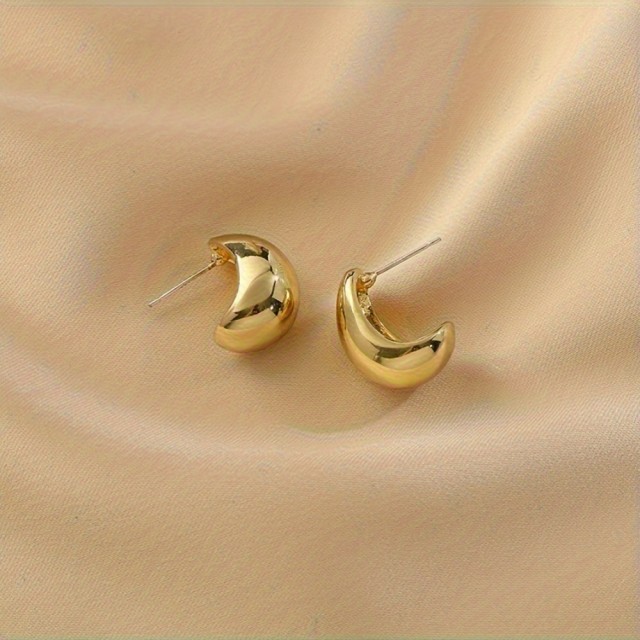 Elegantni zlati uhani v obliki kapljice