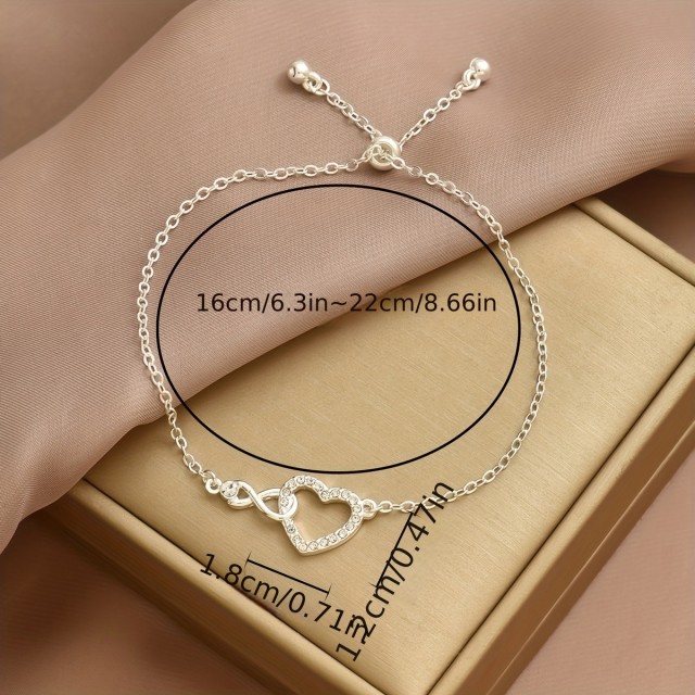 Elegantna zapestnica s srcem in simbolom neskončnosti