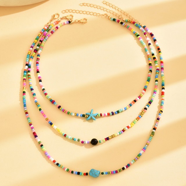 Komplet 3 poletnih ogrlic s pisanimi perlicami