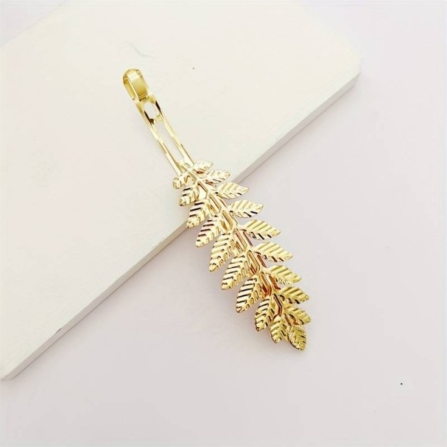 Špangica za lase zlate barve, vejica z listi