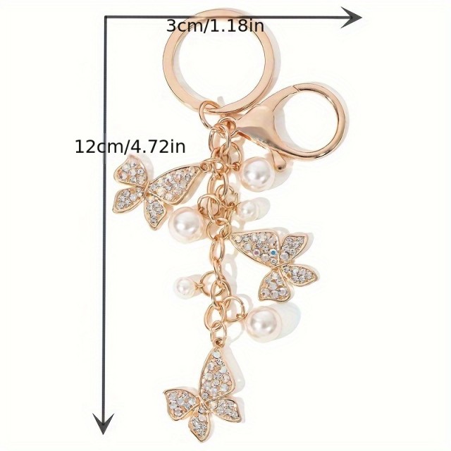 Obesek za ključe z metuljčki in perlicami
