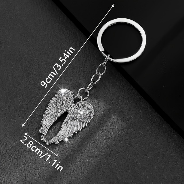 Obesek za ključe z bleščečimi krili