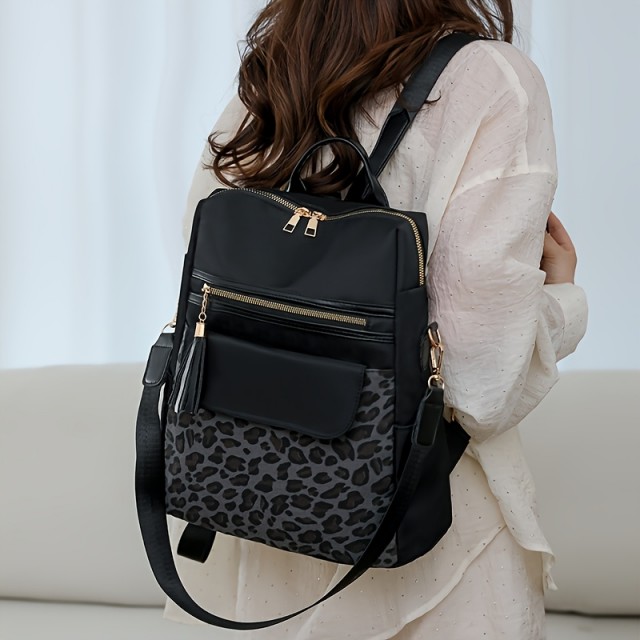 Elegantni nahrbtnik z leopardjim vzorcem in več žepi
