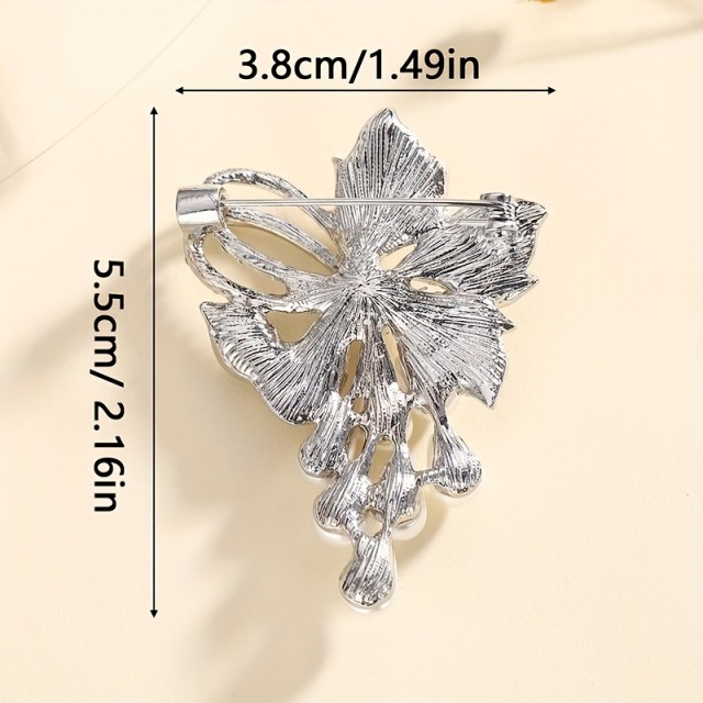 Razkošna cvetlična broška z okrasnimi kamni 