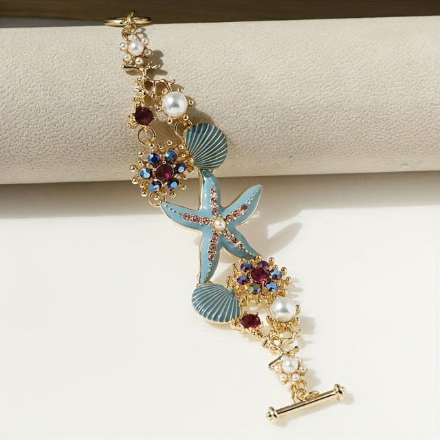 Poletna zapestnica z motivom morske zvezde školjk in koralnimi biseri