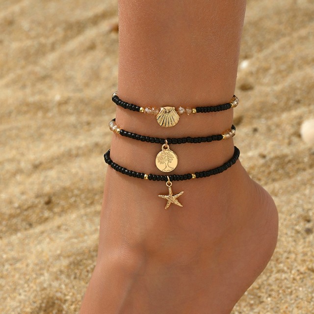 Komplet 3 zapestnic za nogo v črno - zlati kombinaciji