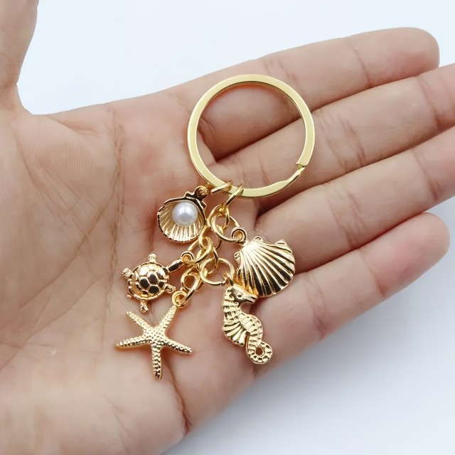Zlat obesek za ključe z morskim motivom