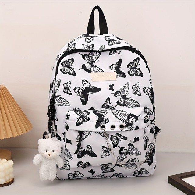 Prikupen črno-bel nahrbtnik z metulji in obeskom medvedka