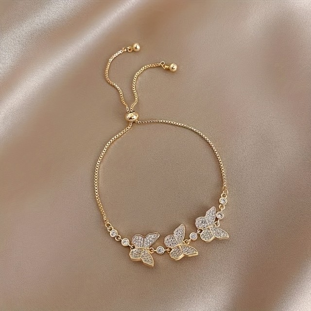 Prestižna zlata zapestnica z metulji in kamenčki