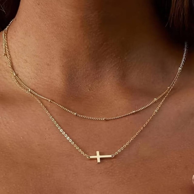 Zlat komplet z ogrlico in zapestnico s križem