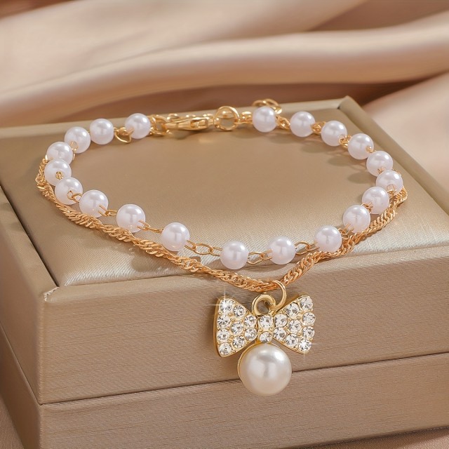 Elegantna zapestnica za nogo s perlicami in pentljo