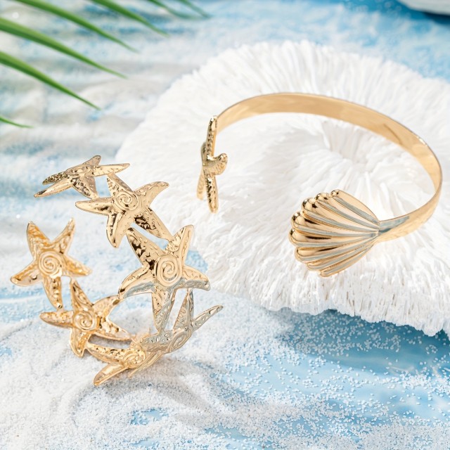 Komplet 2 zlatih nastavljivih zapestnic z morskim motivom