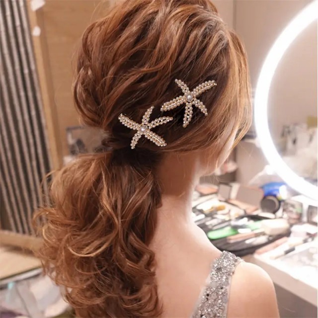 Komplet 2 kovinskih sponk v obliki morske zvezdice