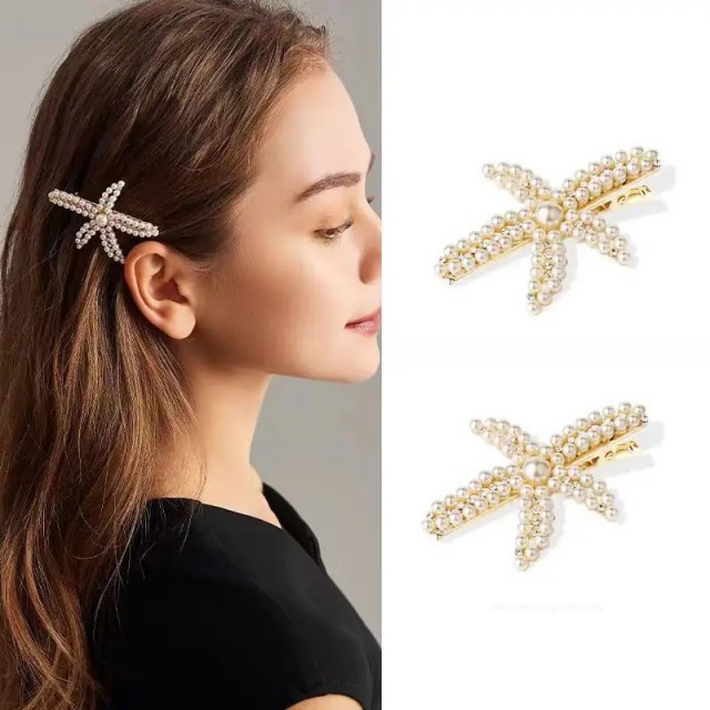 Komplet 2 kovinskih sponk v obliki morske zvezdice