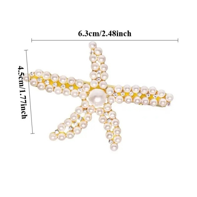 Komplet 2 kovinskih sponk v obliki morske zvezdice