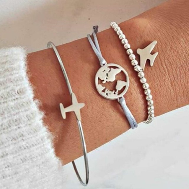 Komplet zapestnic z letalom in svetom v srebrni barvi 