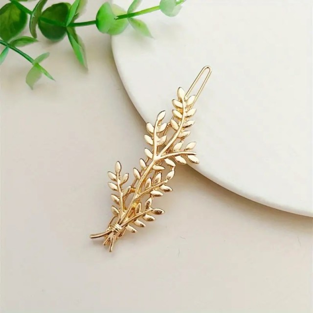 Elegantna zlata lasnica v obliki veje