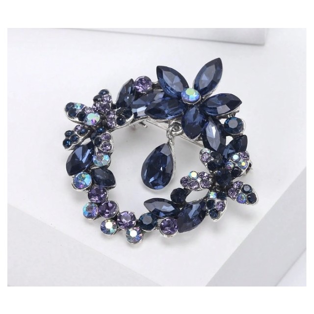 Okrogla broška z modrimi kristali