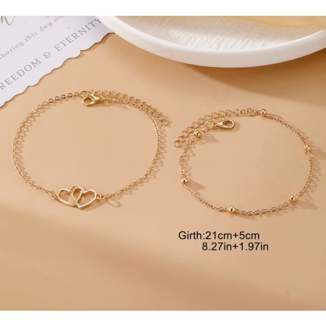 Dvojna zlata zapestnica za nogo s srcem