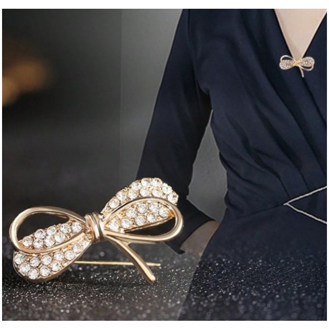 Mini broška zlate ali srebrne barve s pentljico