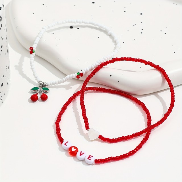 Komplet 3 zapestnic za nogo s češnjami in LOVE napisom