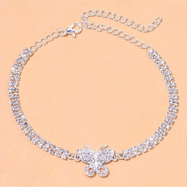 Elegantna zapestnica za nogo z metuljem srebrna