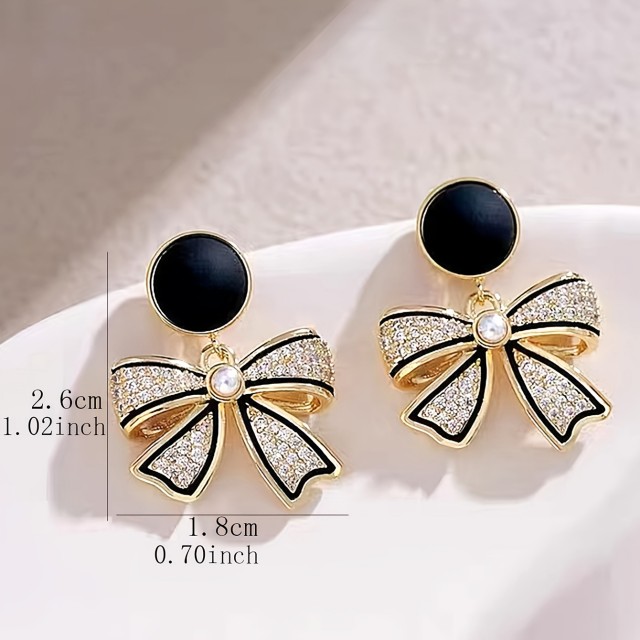 Elegantni uhani iz zlitine s pentljico