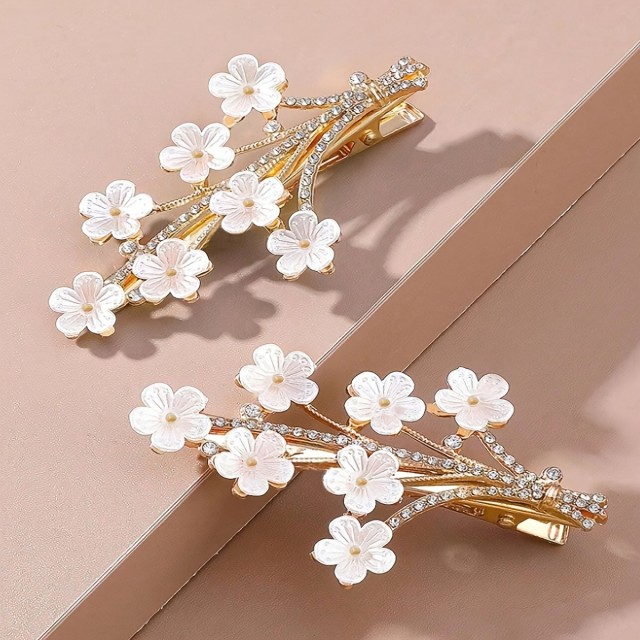 Elegantna cvetlična sponka za lase – zlati detajli