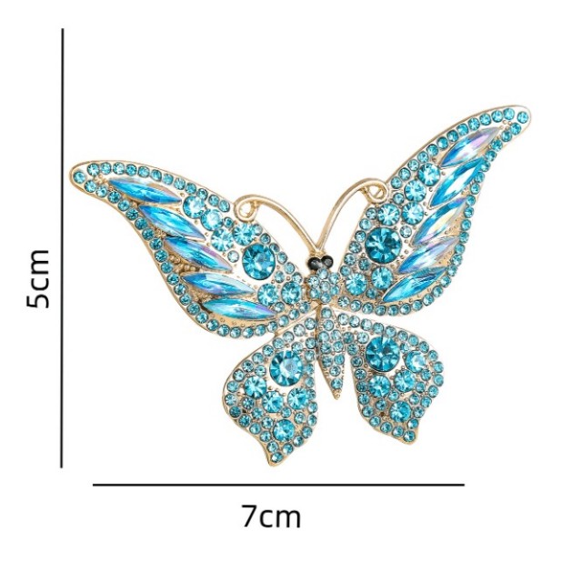 Elegantna broška z modrim metuljem 