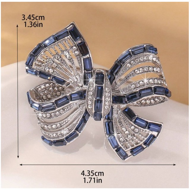 Broška v obliki pentlje v modri barvi 