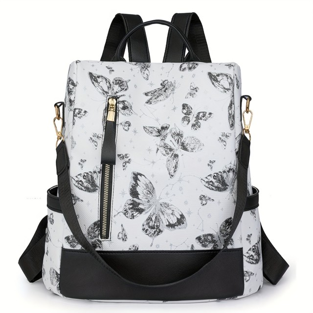 Ženski nahrbtnik v črno beli barvi z metulji