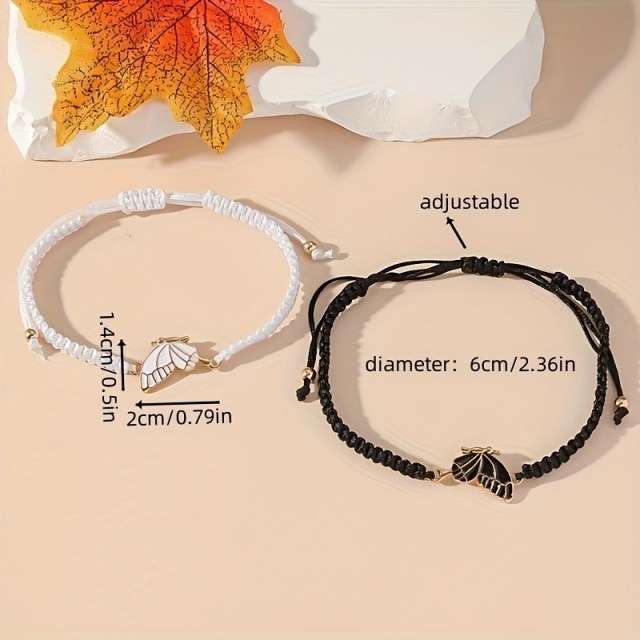 Komplet dveh zapestnic s črnim in belim metuljem