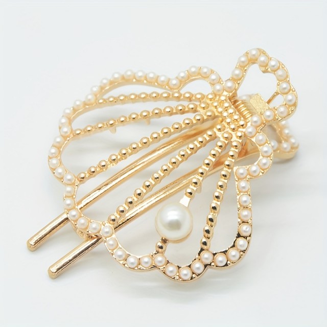 Elegantna kovinska sponka za lase v obliki školjke